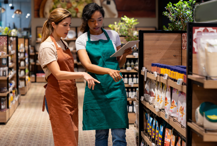 Frontline retail employees using a digital device at work